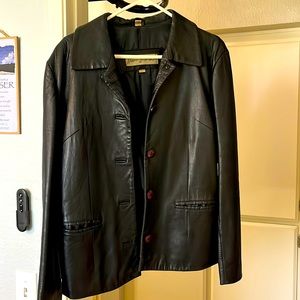 Black leather jacket, REM Garson. Vintage .minor damage on the back.